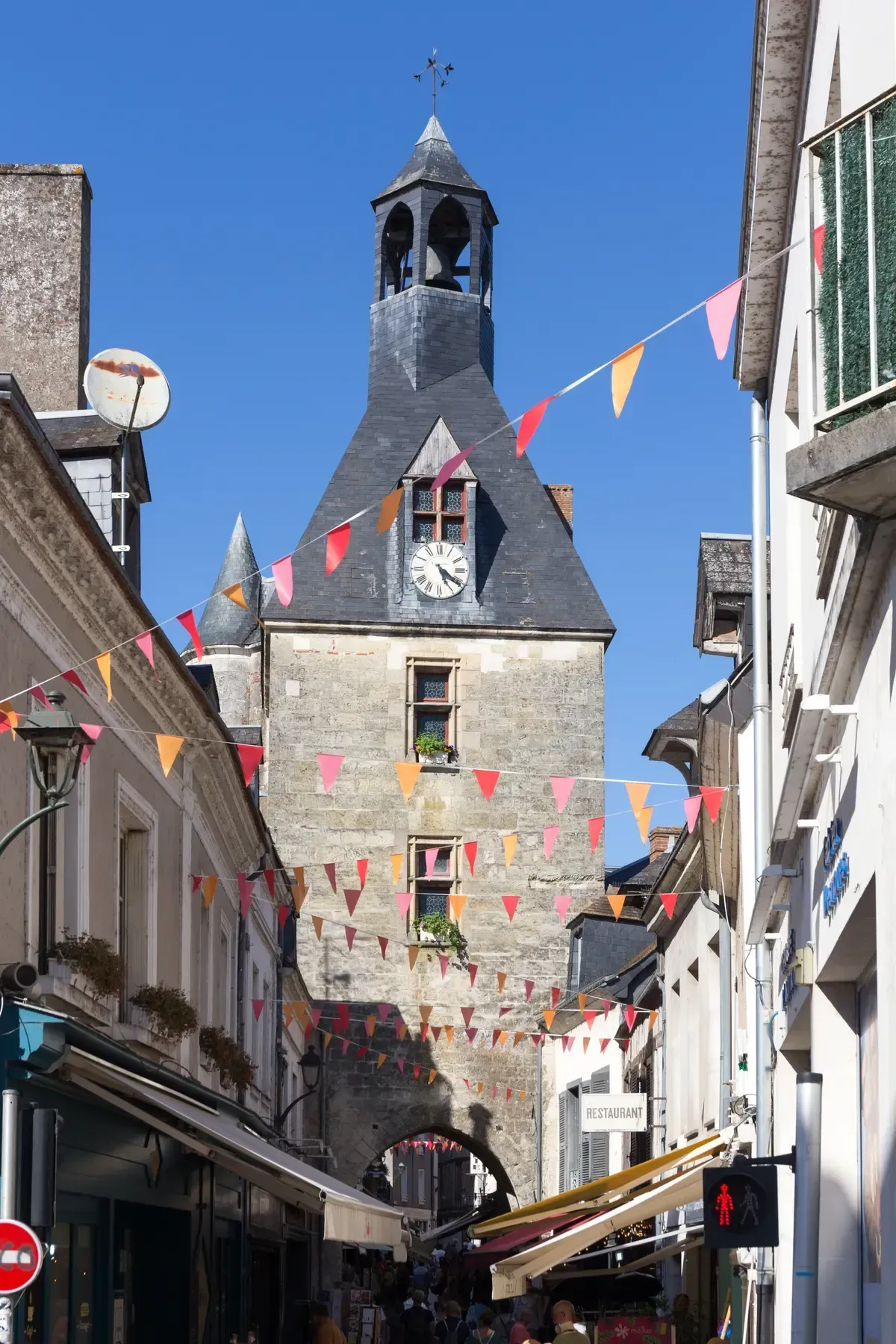 The clock tower over a street in Amboise, the town at the end of a Loire Valley wine and castle tour from Paris