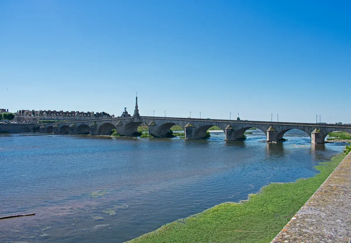 The stone bridge over the Loire at Blois, where the bus to Chambord starts for travellers without Loire Valley wine and castle tours