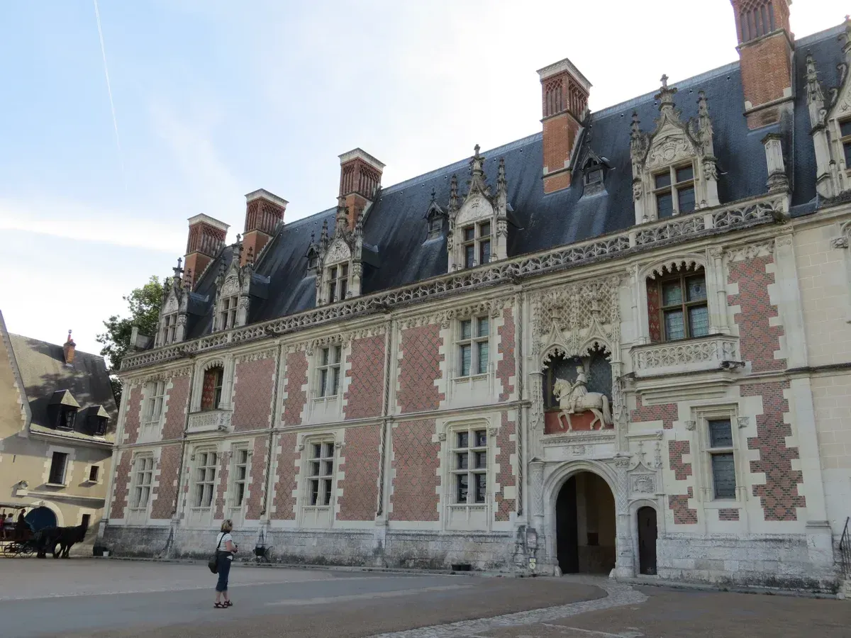 The Louis XII wing of the Château de Blois, near the free-time stop on a Loire Valley wine and castle tour from Paris