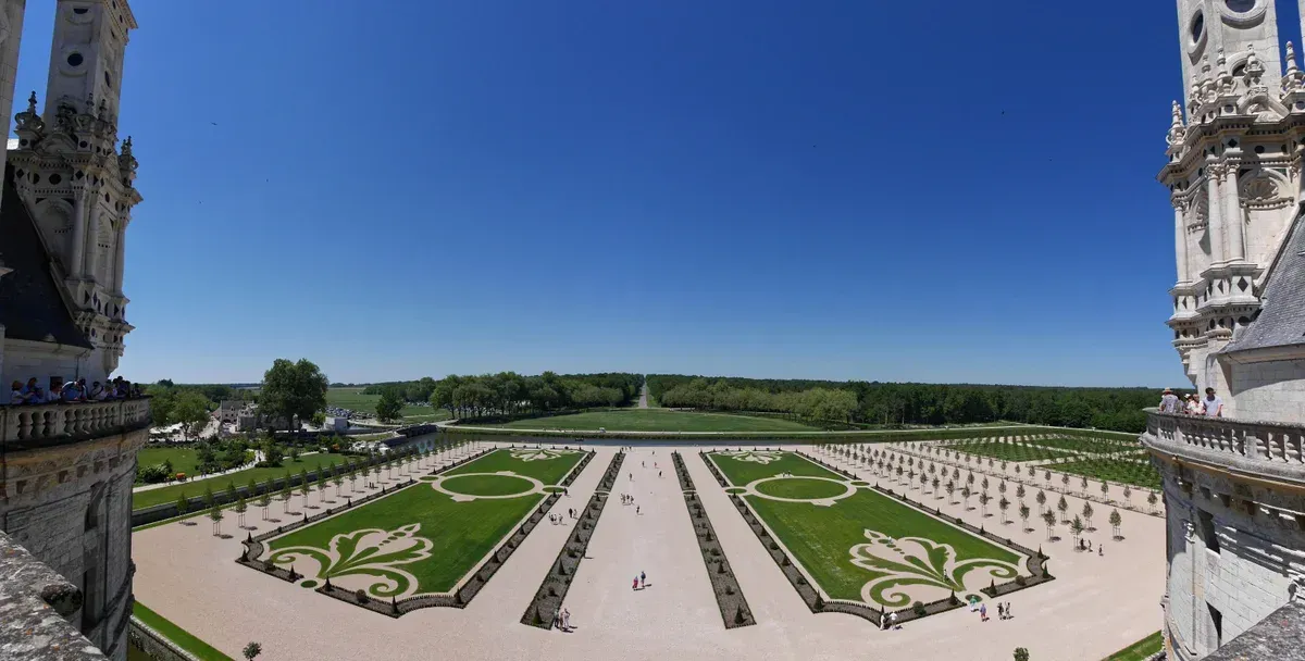 The formal gardens of Chambord seen from the roof, visited on Loire Valley wine and castle tours from Paris