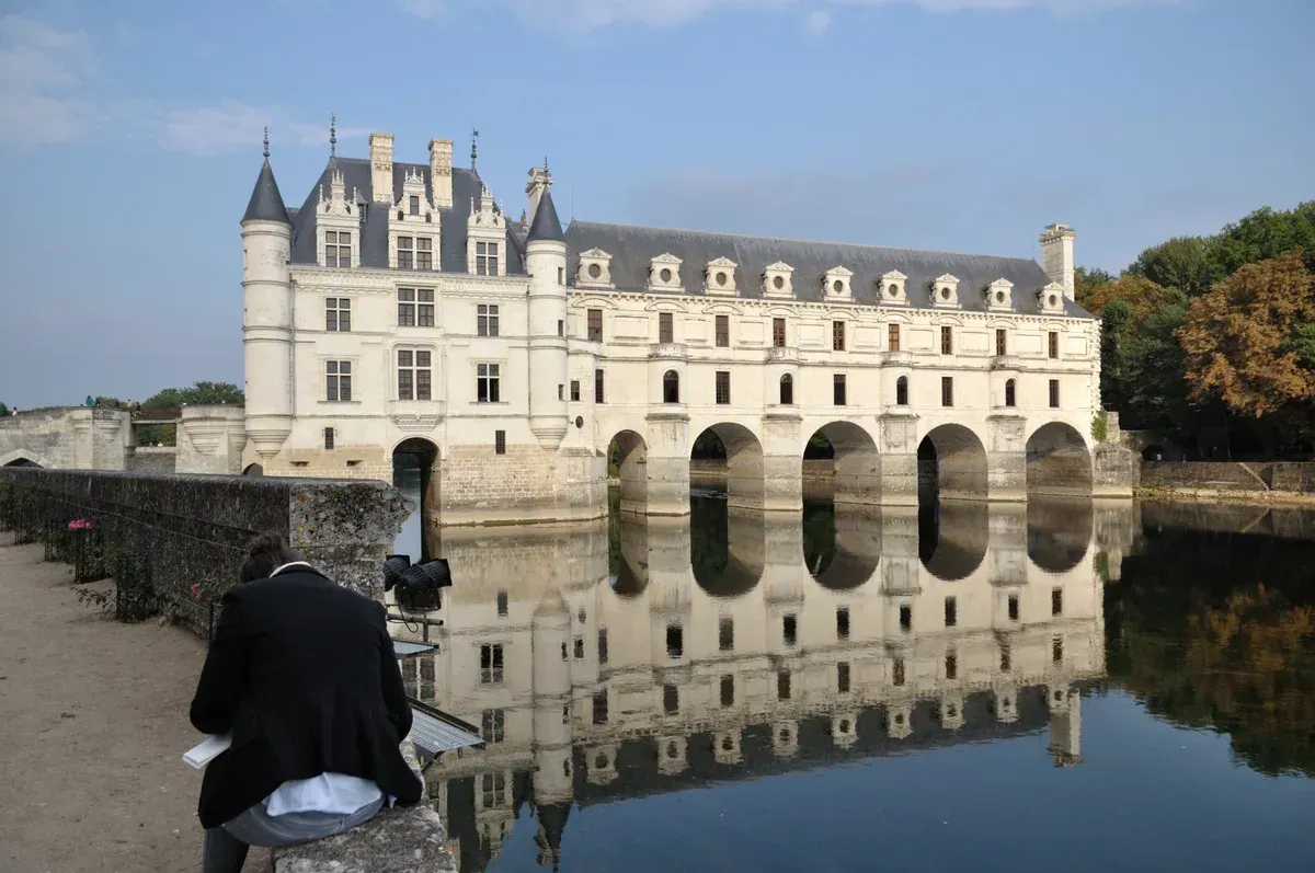 Château de Chenonceau reflected in the Cher, the afternoon stop of a Loire Valley wine and castle day trip from Paris